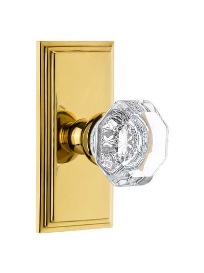 Grandeur Carre Rosette Door Set with Chambord Crystal-Glass Knobs in Polished Brass.
